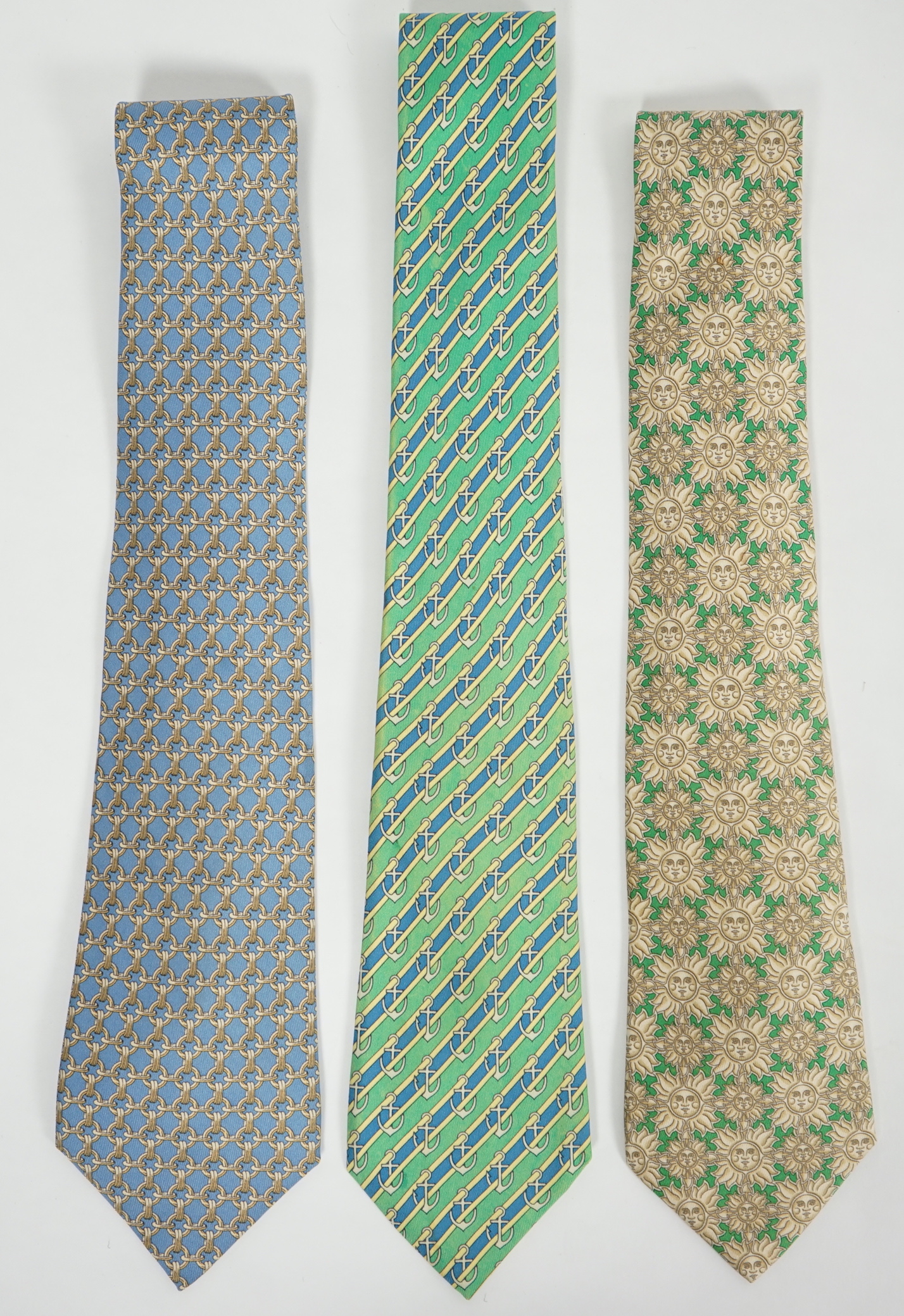 Three Hermès gentlemen's assorted patterned silk ties